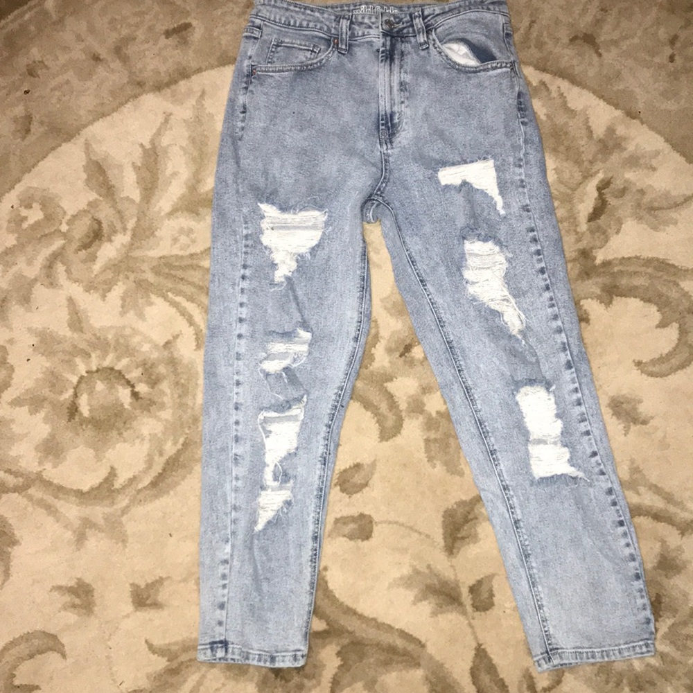 Women’s distressed blue jeans